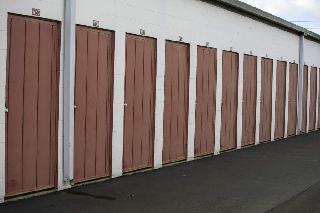 Interior view of a 5×5 storage unit at McDowell Mountain Community Storage in Scottsdale Arizona showcasing organized boxes and small furniture