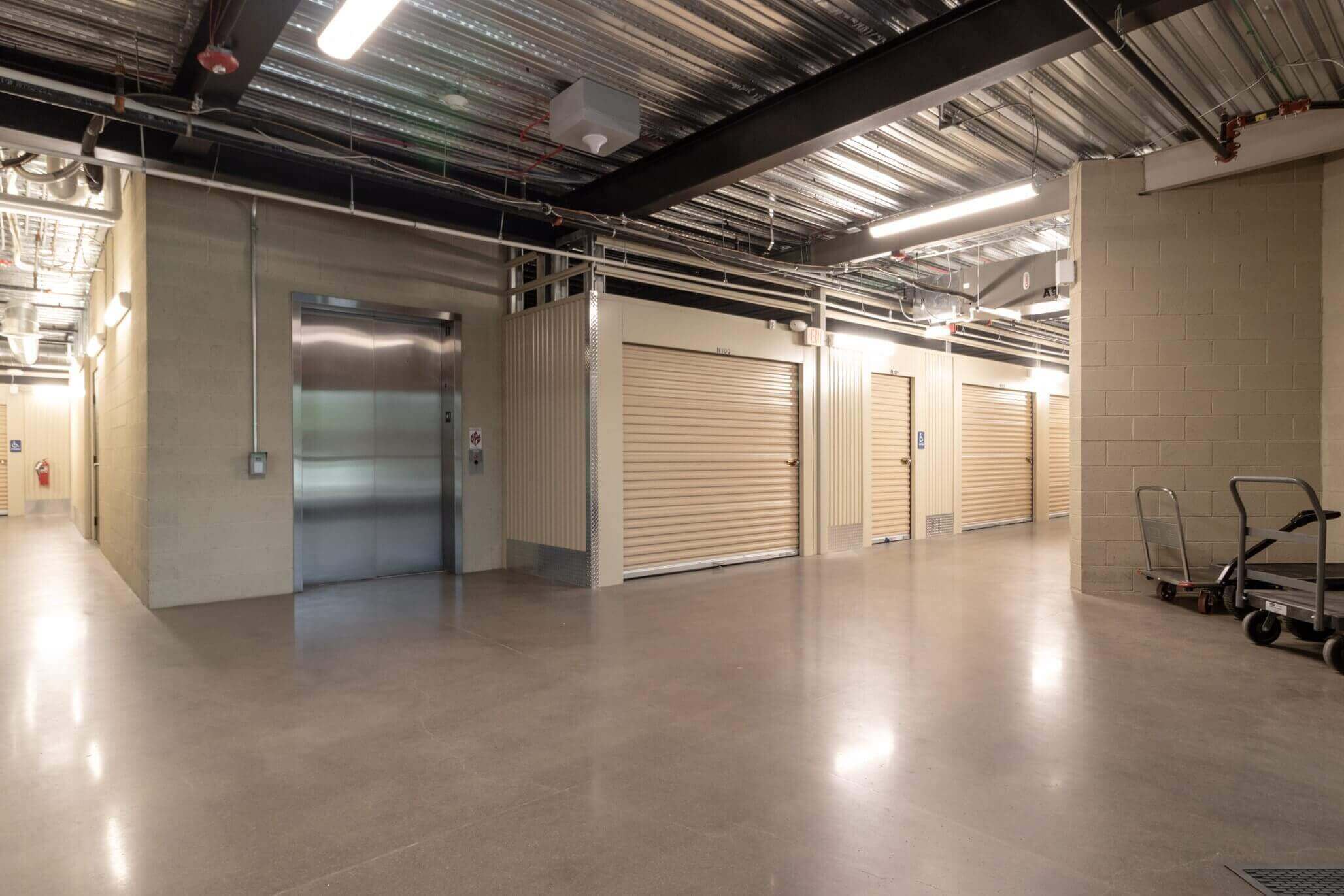 Organized storage boxes with clear labels placed on shelving units at McDowell Mountain Community Storage in Scottsdale, AZ