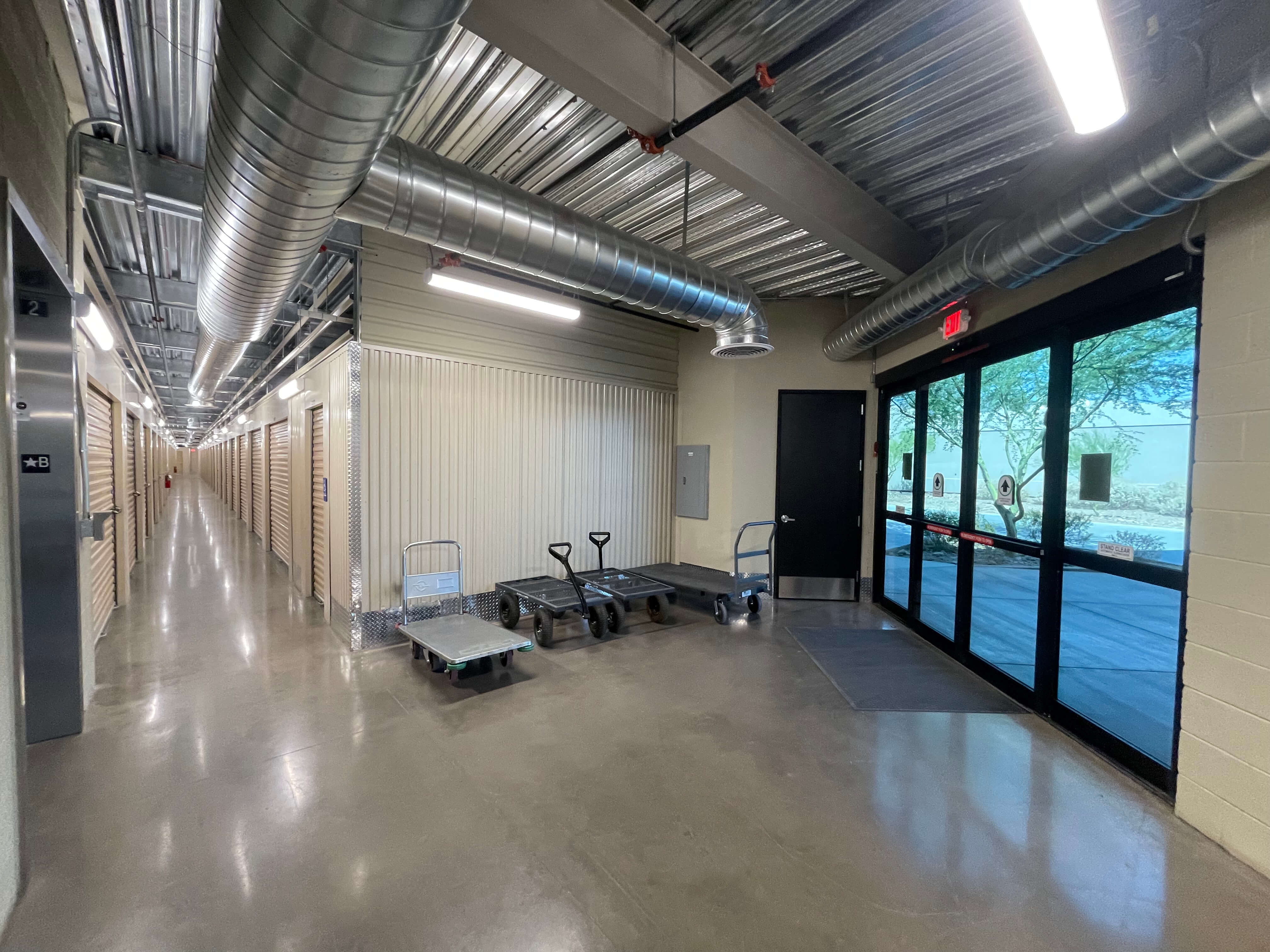 A well organized storage room with shelves bins labeled containers and hooks at McDowell Mountain Community Storage in Scottsdale Arizona